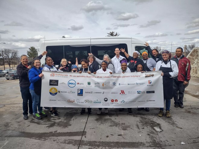 group of people holding banner