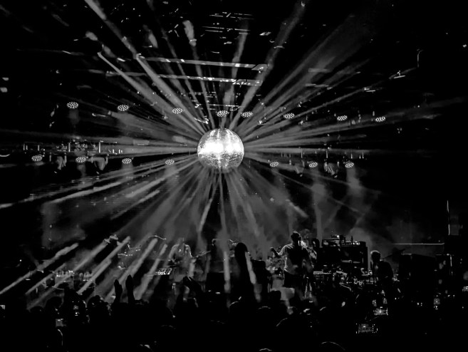 a star-like burst of electric lights on stage