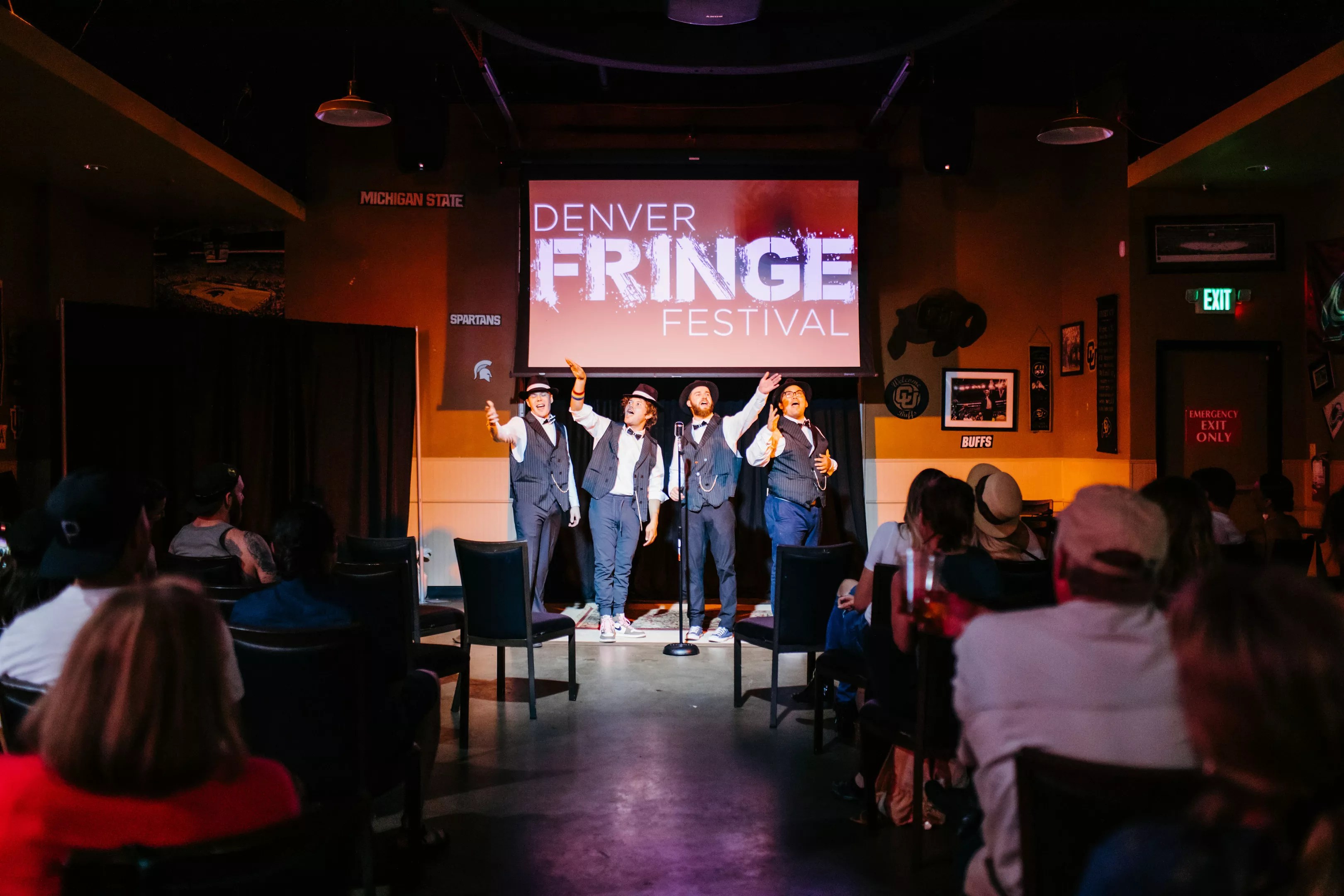 a troupe bows on stage