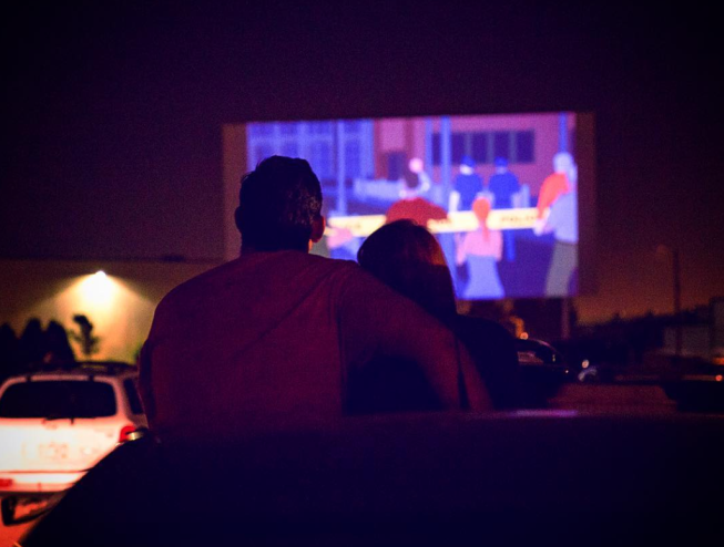 A couple watching a movie at the 88 Drive-In Theater in Commerce City, Colorado.