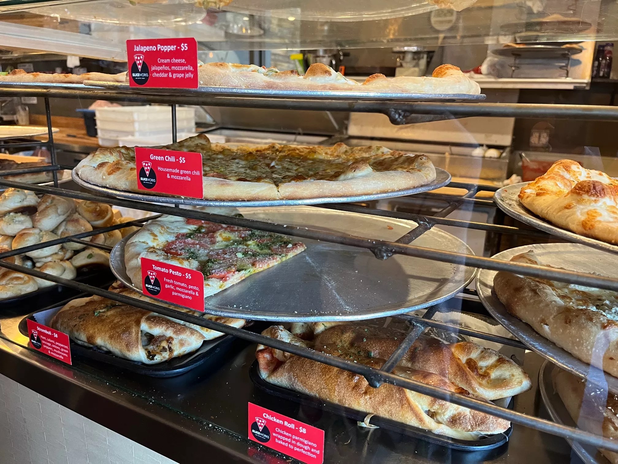 Pizzas in a glass case