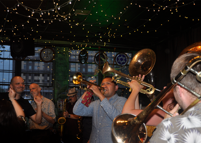 brass band plays in Mercury Cafe