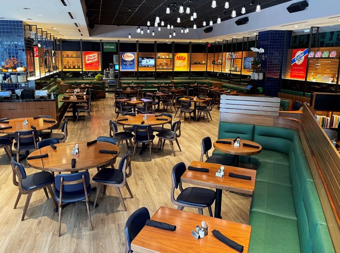 Interior of a restaurant with empty tables and chairs