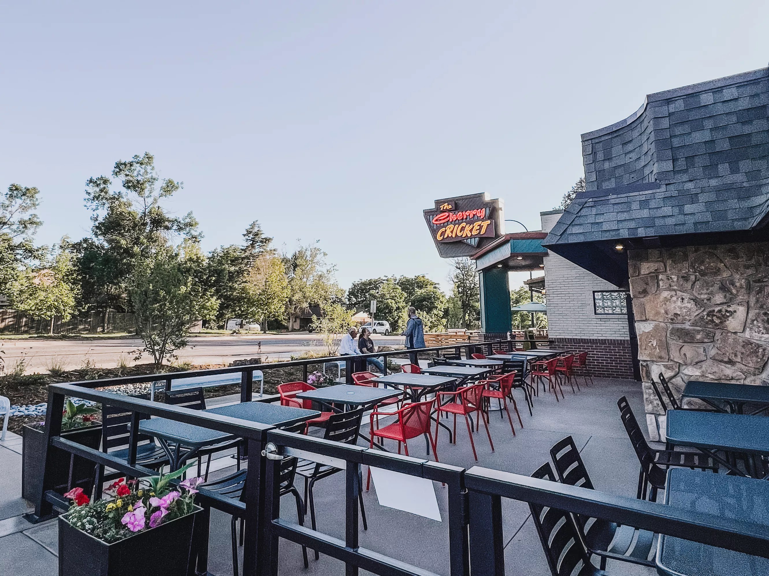 a patio set with tables and chairs