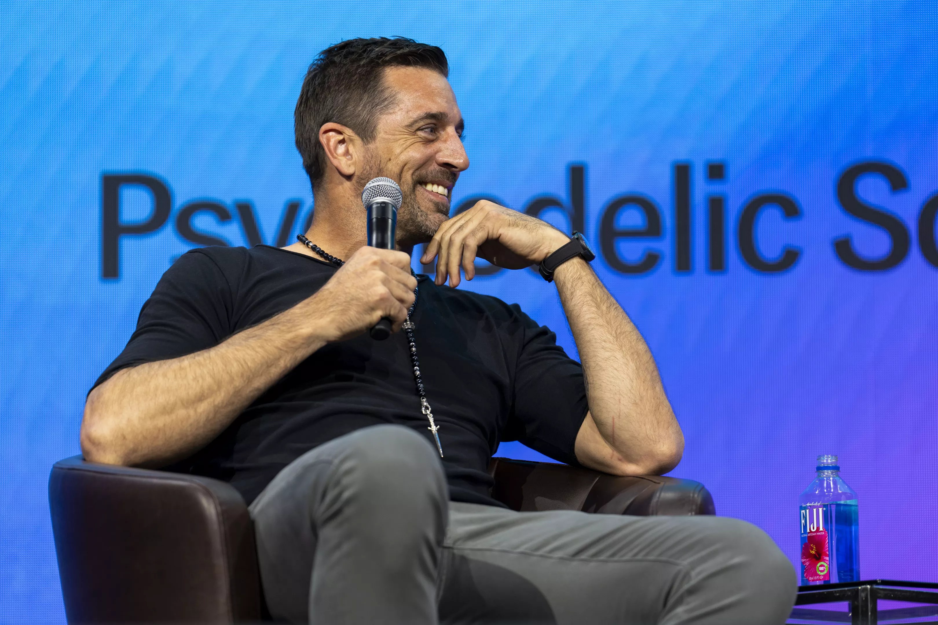Quarterback Aaron Rodgers speaks at Psychedelic Science 2023 in Denver.