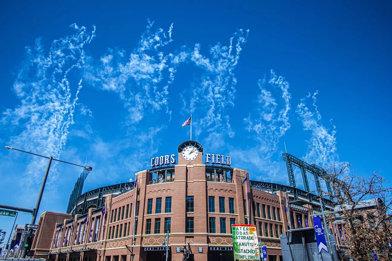 coors field ballpark with sky and smoke from fireworks