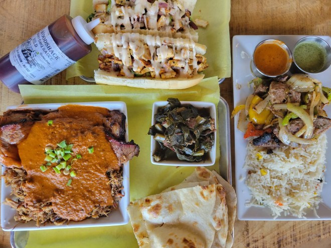 a variety of dishes on silver trays