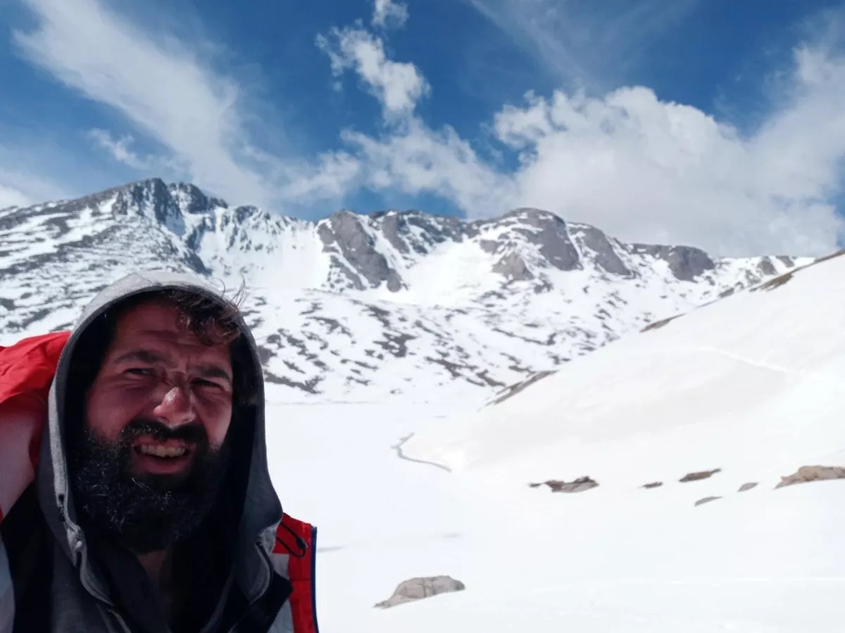 Hiker Bryan Scarbeary takes a picture near the summit of Mount Evans after an 18-day hike starting in the city.