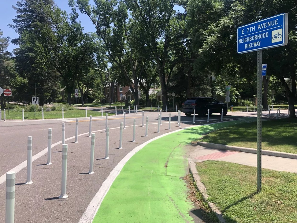 bike lane and white bollards on residential street