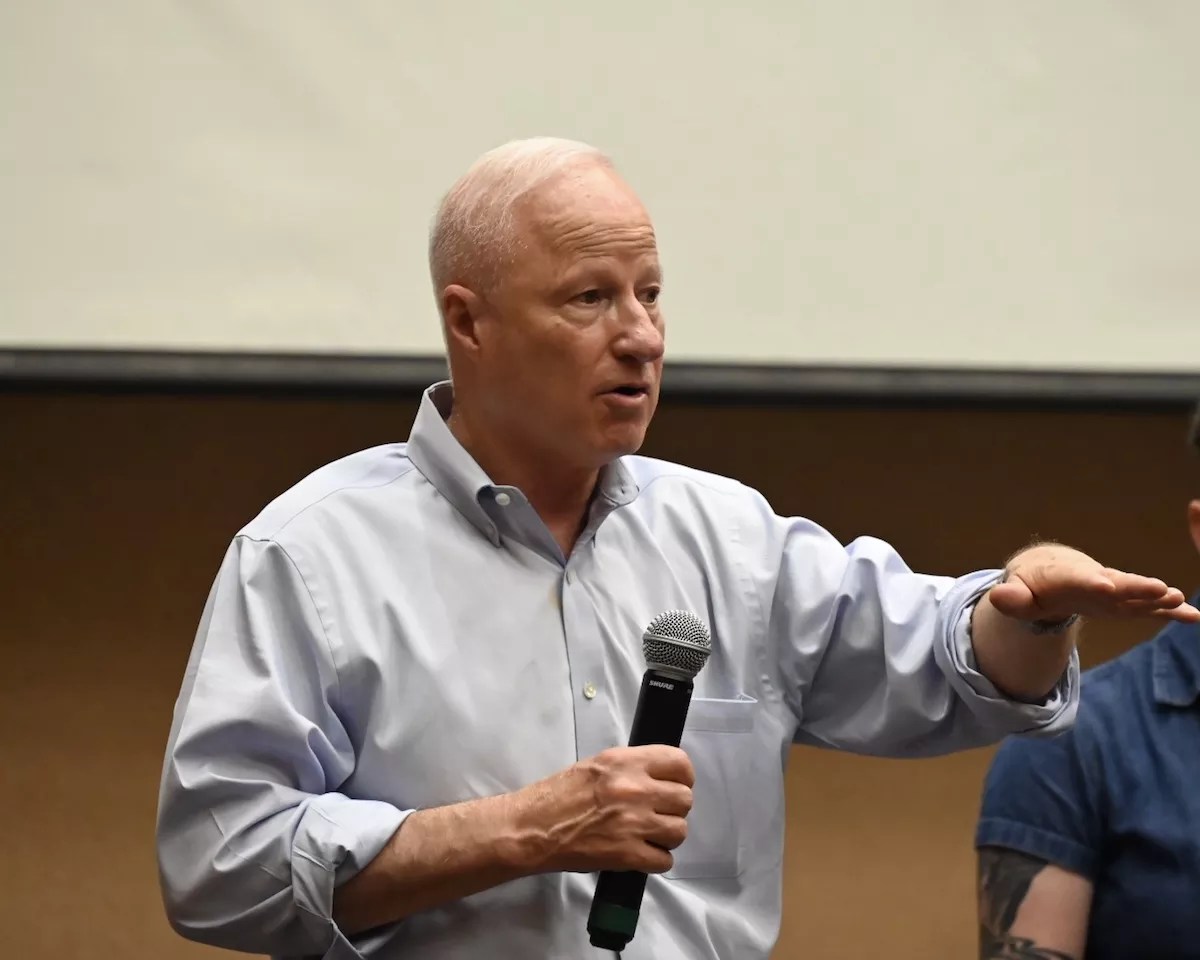 Mike Coffman speaks at a town hall in mid-July.