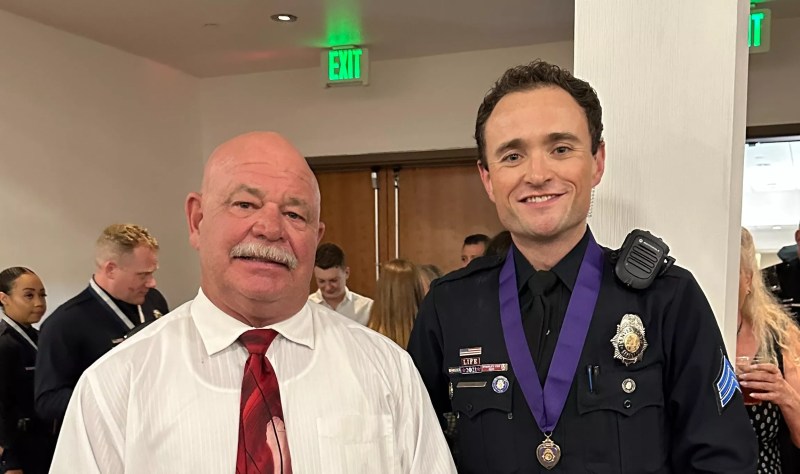 Retired DPD Division Chief Ron Saunier posing with his son, Sgt. Kyle Saunier, at the Denver Police Foundation's award ceremony.