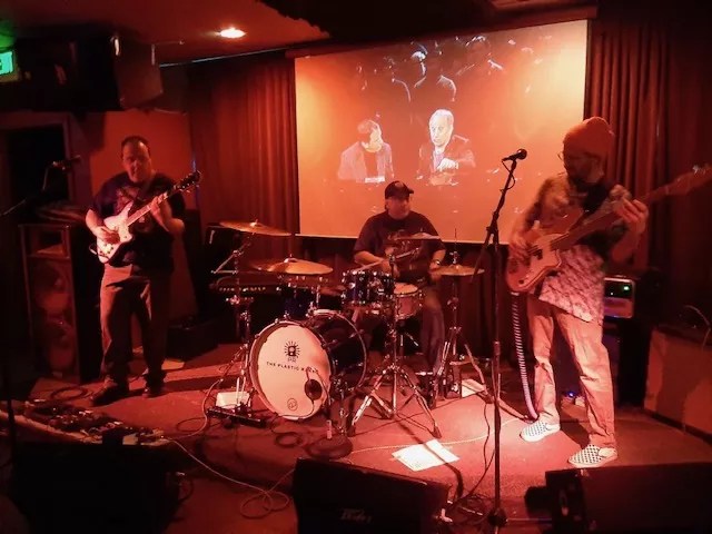 a band plays on a stage