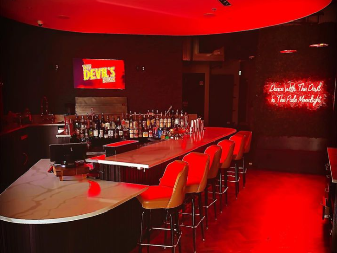 a bar with red lights