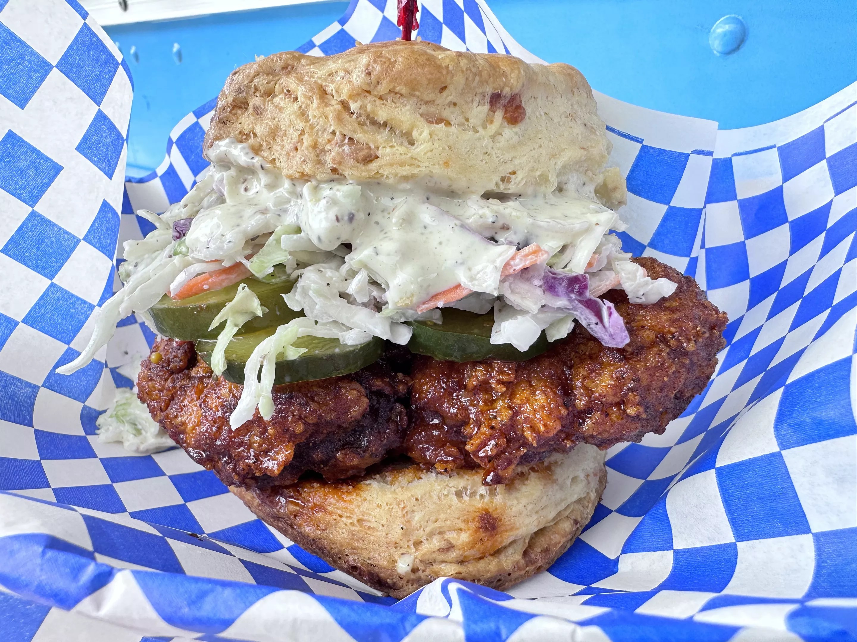 fried chicken and coleslaw on a biscuit