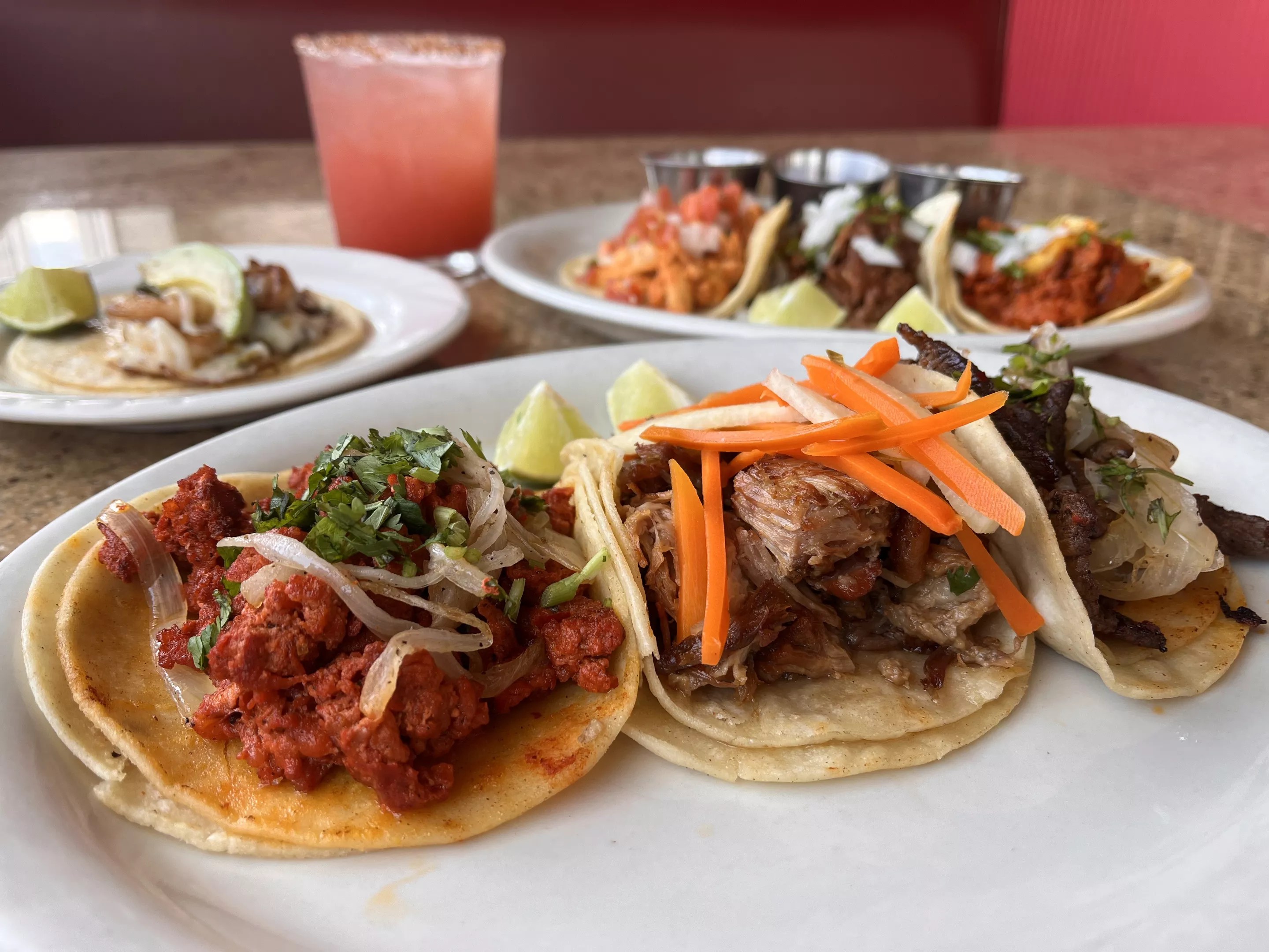 a variety of tacos on a plate