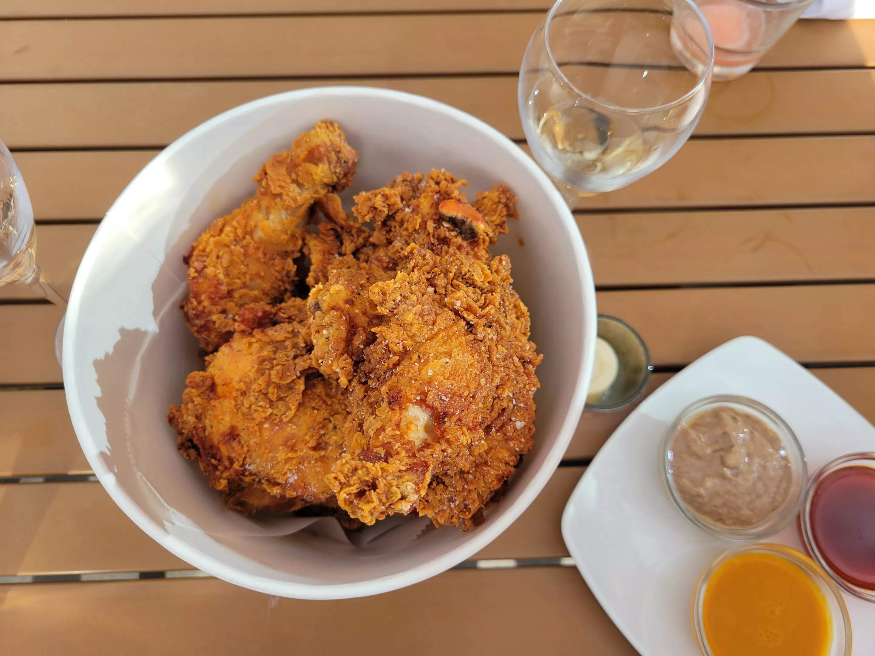 bucket of fried chicken with sauces