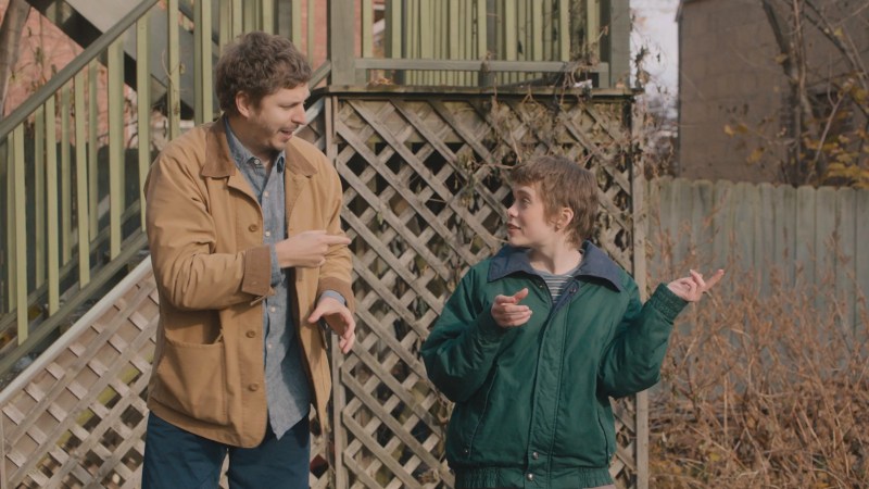 actors Michael Cera and Sophia Lillis on set of a movie.