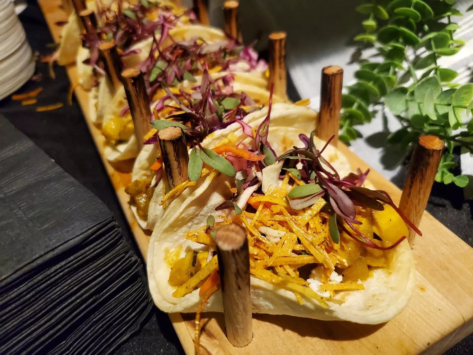 tacos lined up on a board