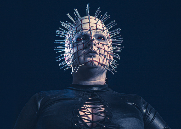 a cosplayer with nails coming out of their face