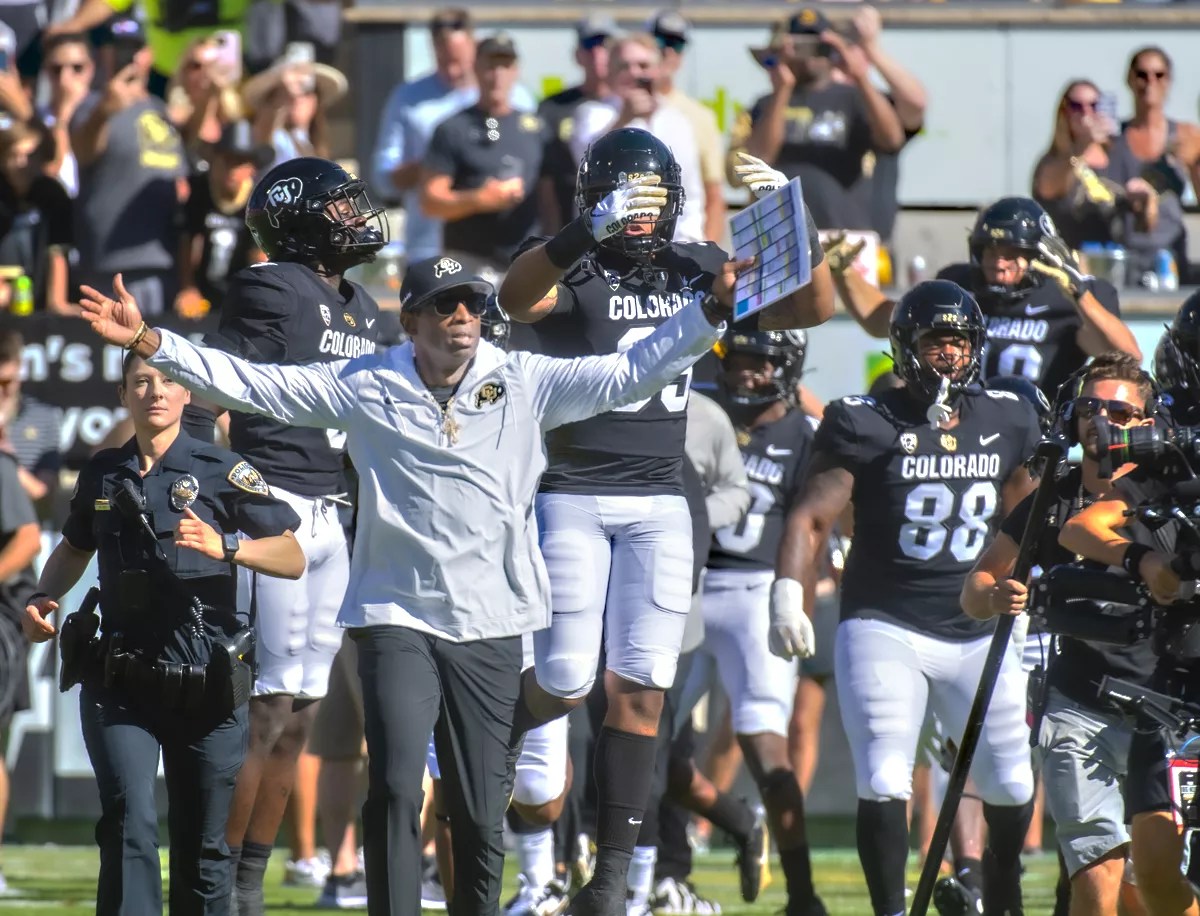 Deion sanders coaches football on sidelines