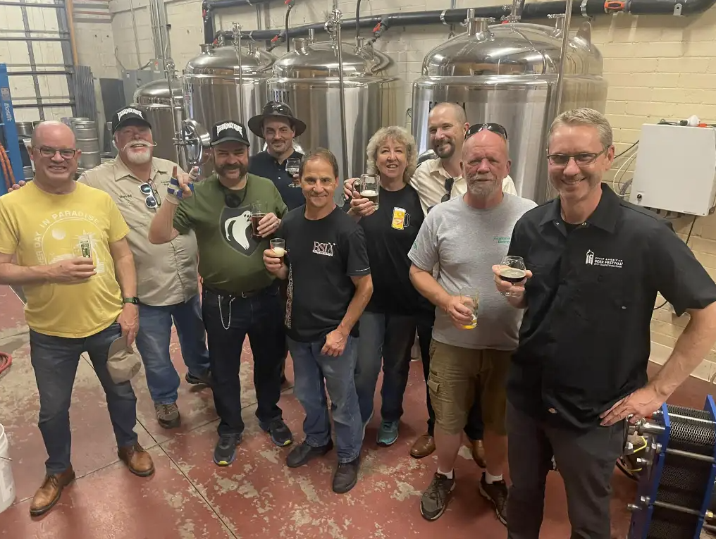 Group of men in a brewery