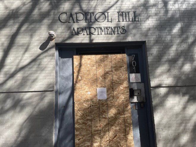 The Capitol Hill Apartments boarded up after a September 7 fire.