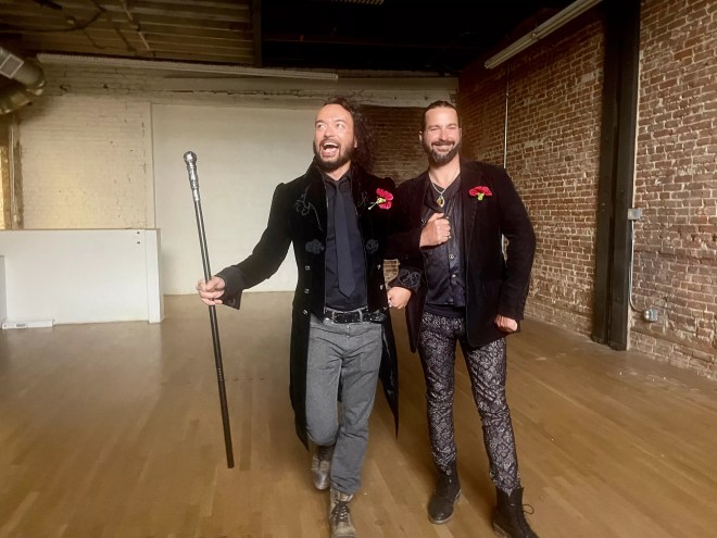 two men in black suits