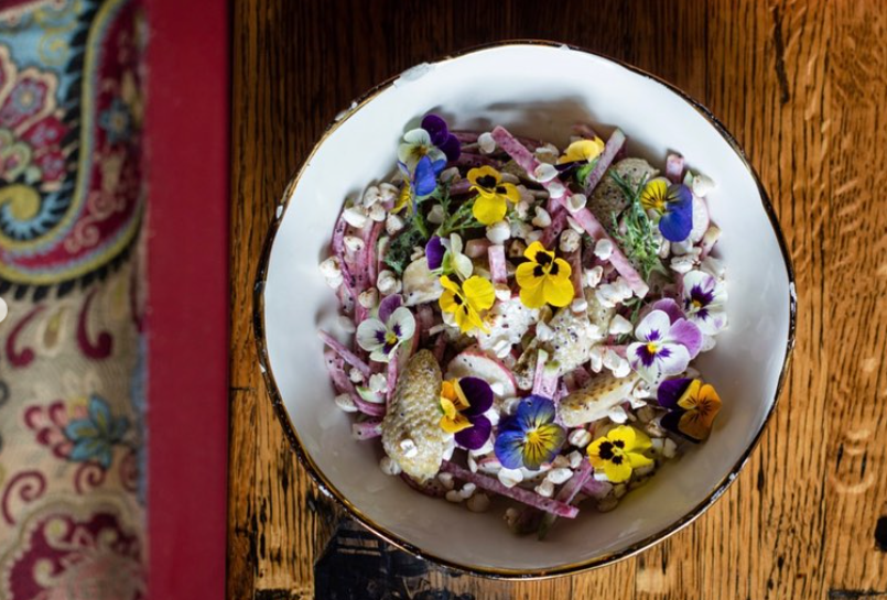 food garnished with flowers on a plate
