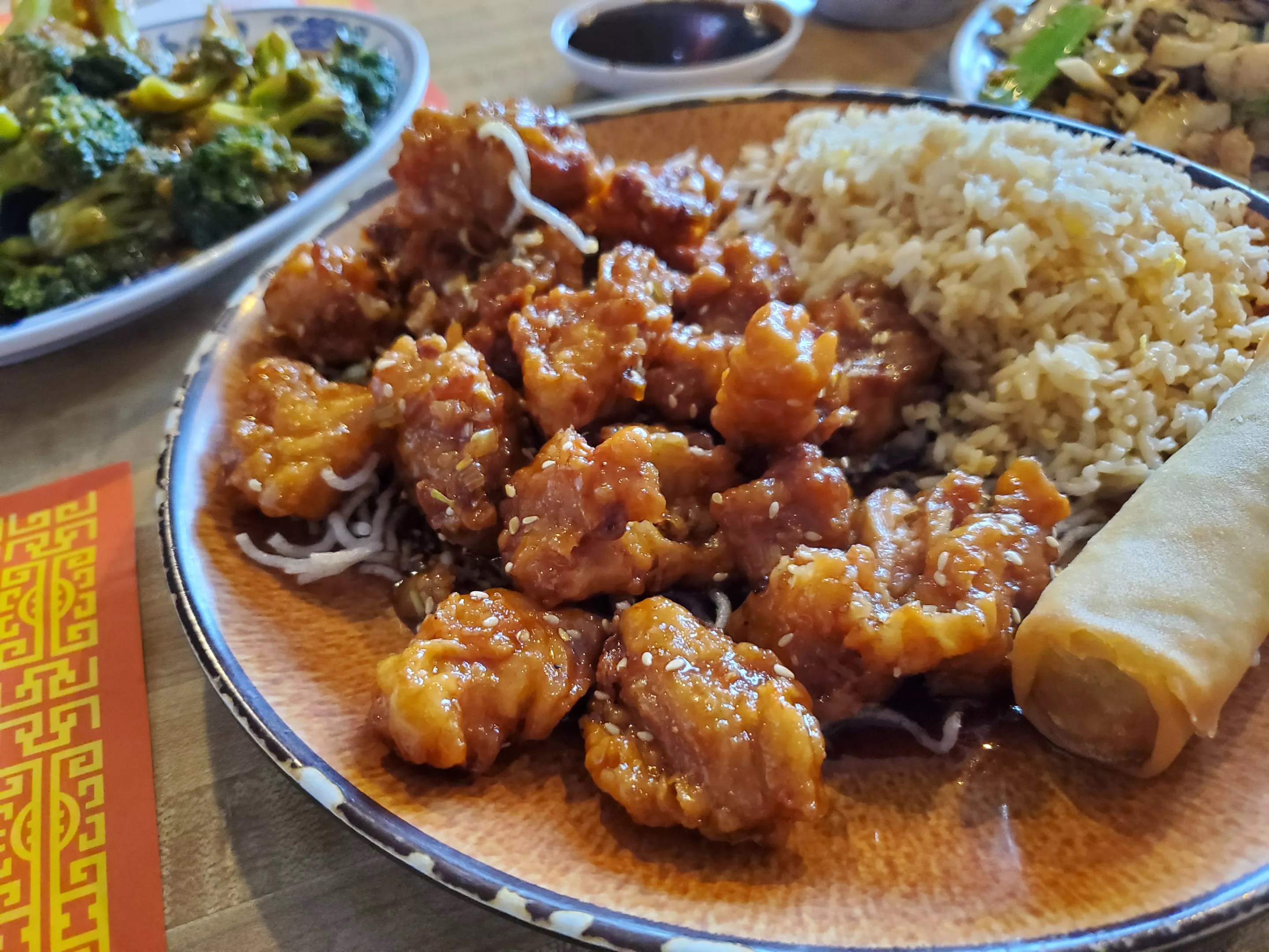 small pieces of fried chicken on a plate with rice