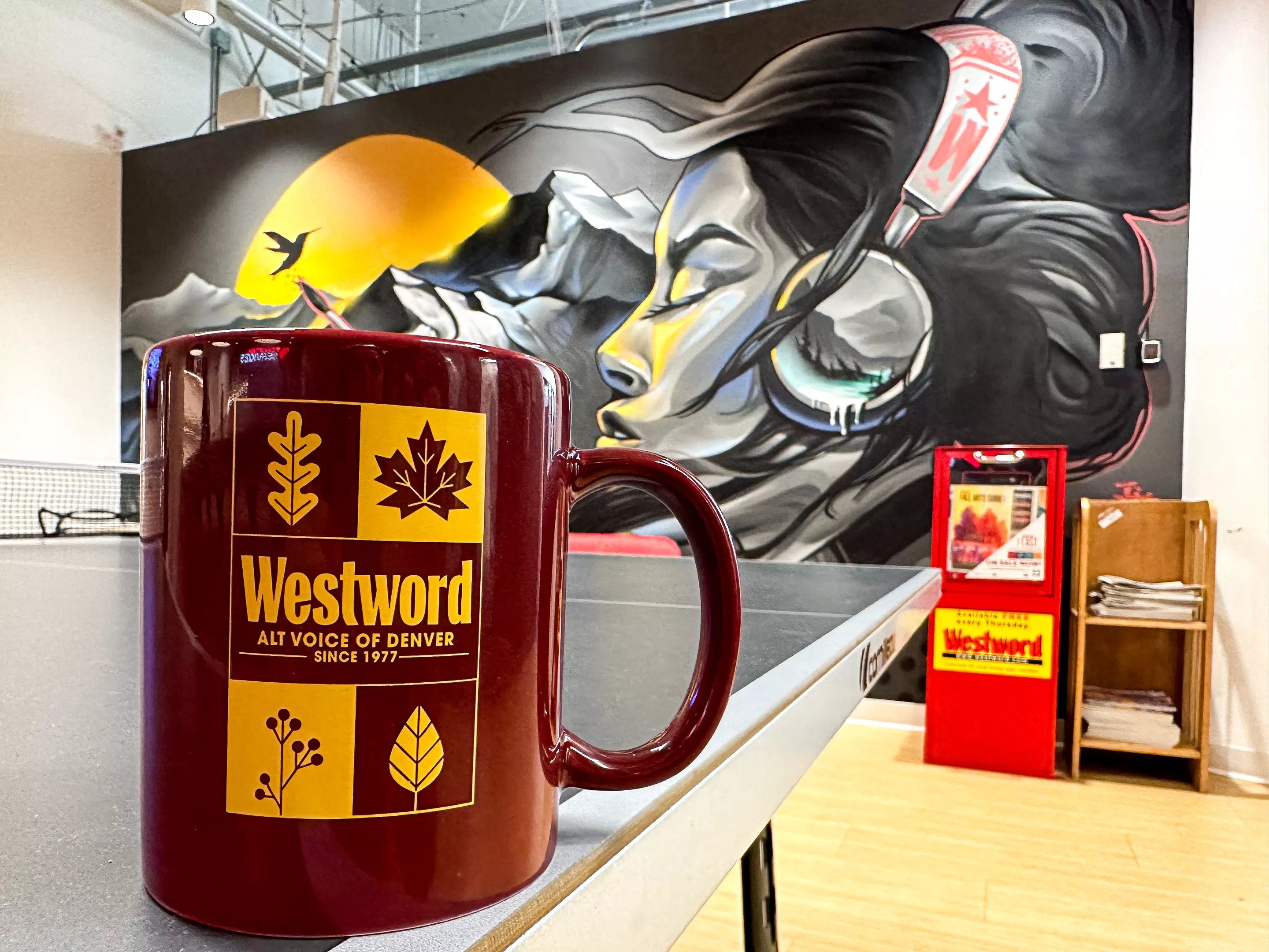 Maroon coffee mug with gold text