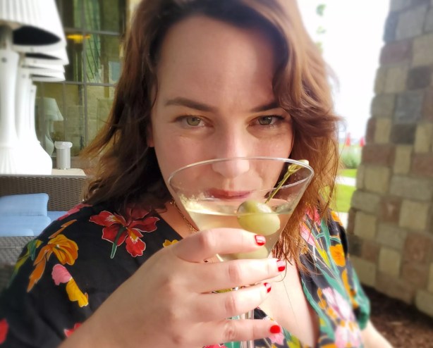 woman sipping martini