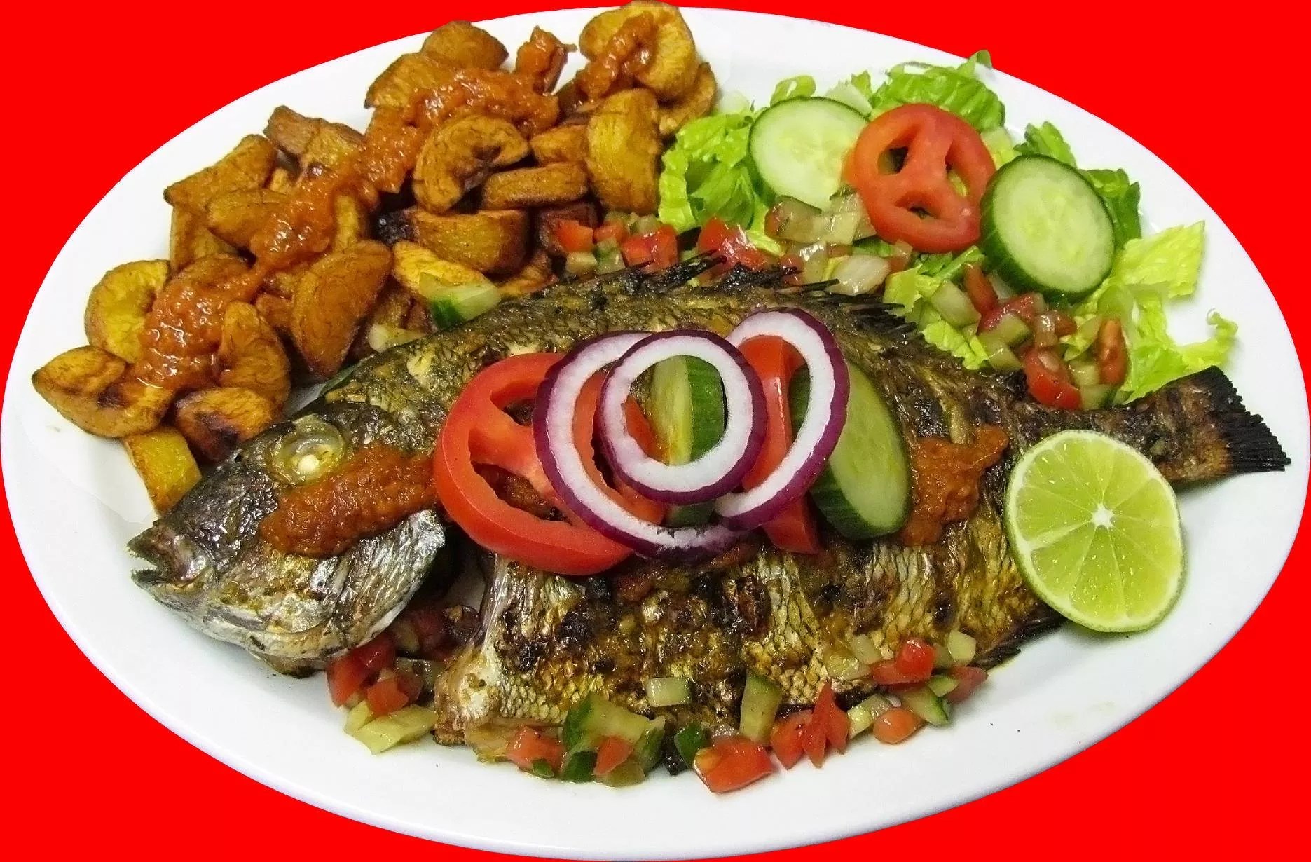 fried fish and plantains on a platter