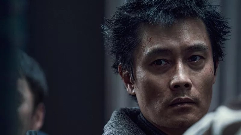 man looking to his right with a sad expression