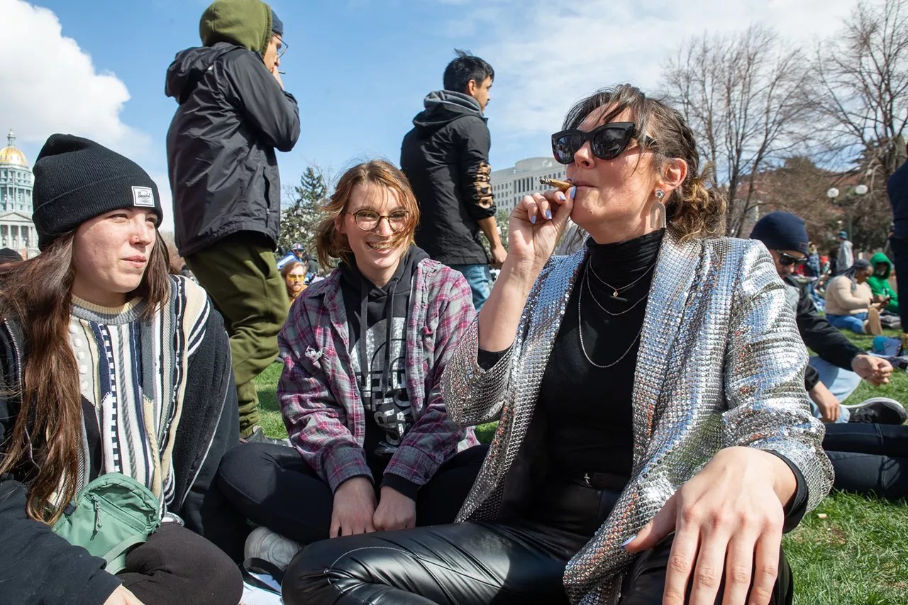 Women smoke marijuana at Civic Center Park in Denver