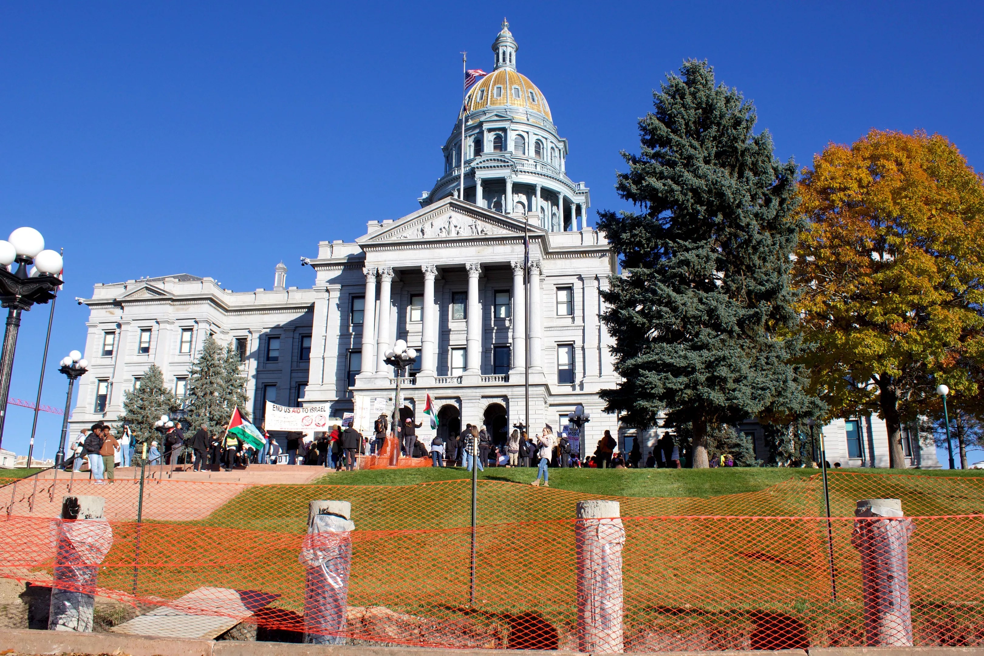 A group of pro-Palestine protestors rally at the west steps of the Colorado Capitol Building.