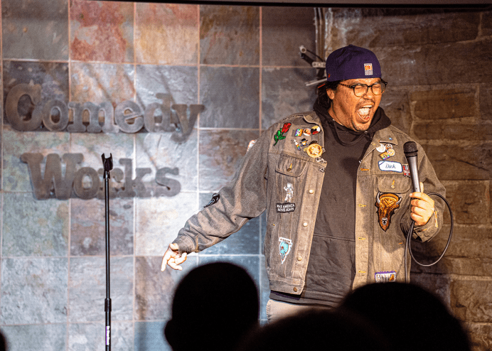 comedian performing on stage