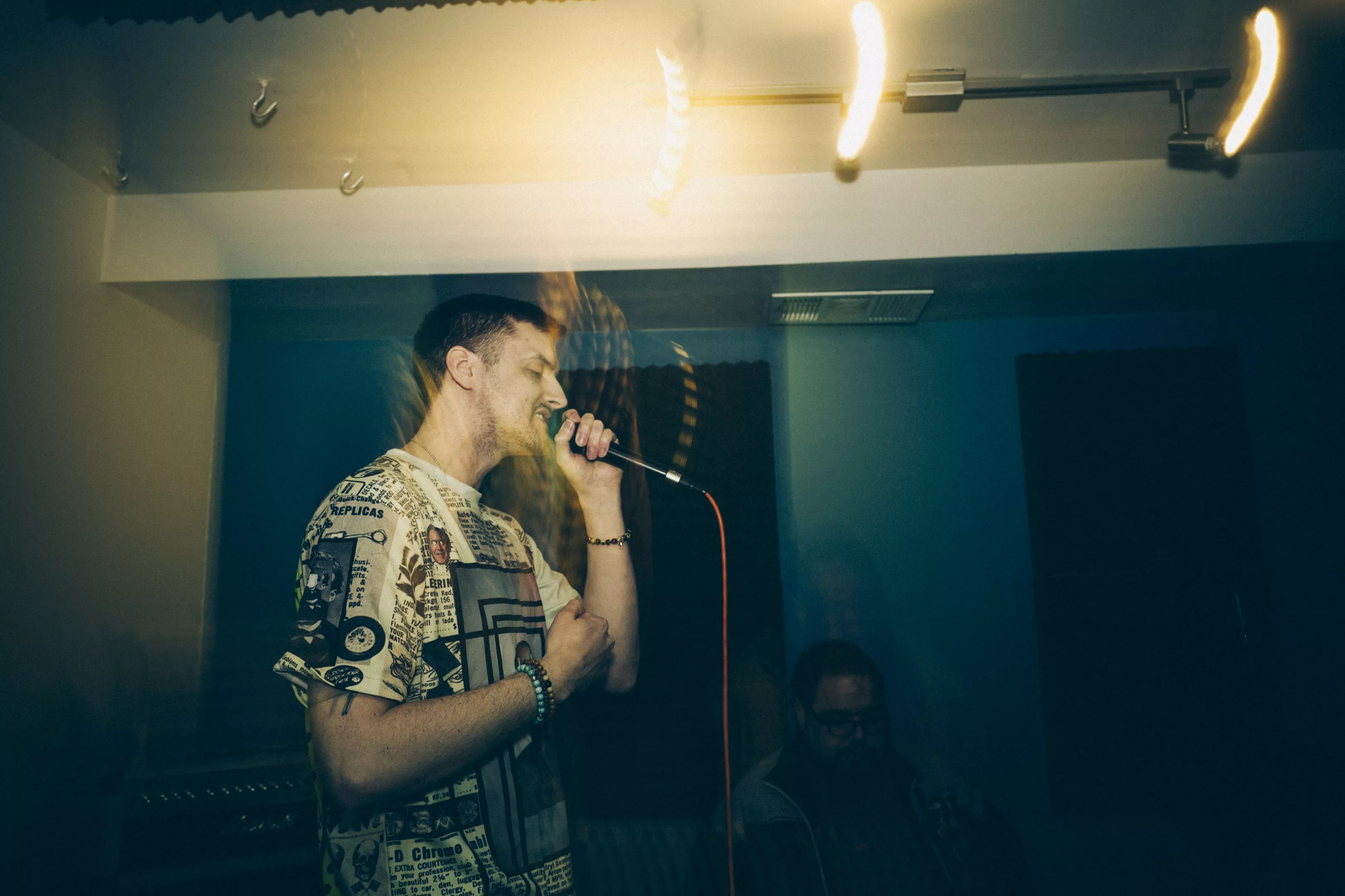 man rapping into microphone