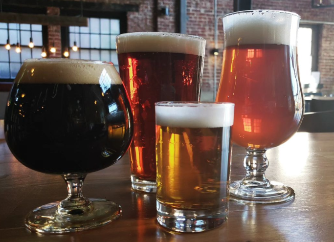 different beers in a variety of glassware