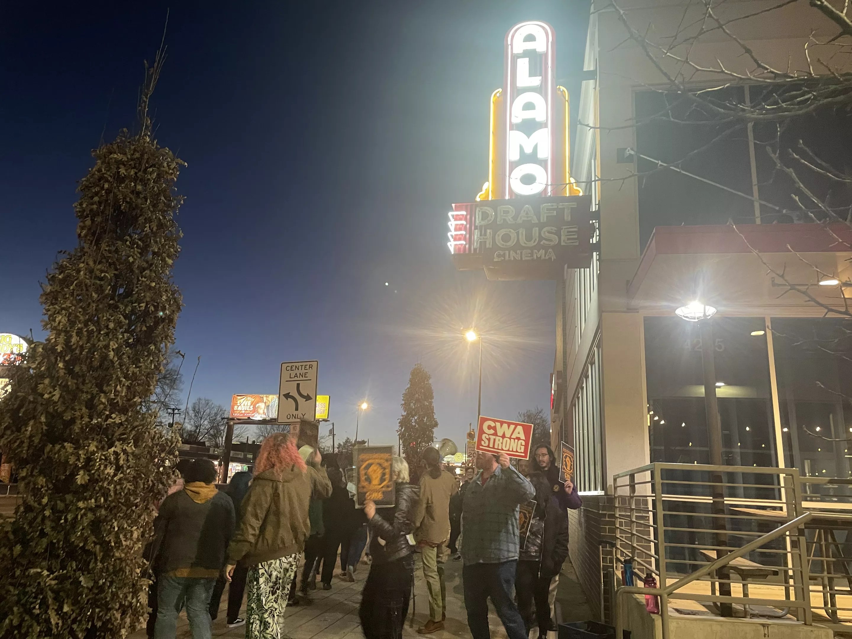 A crowd of people outside of Alamo Drafthouse.