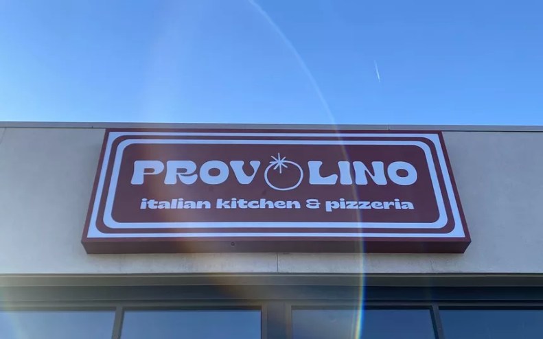 red and white sign on a building