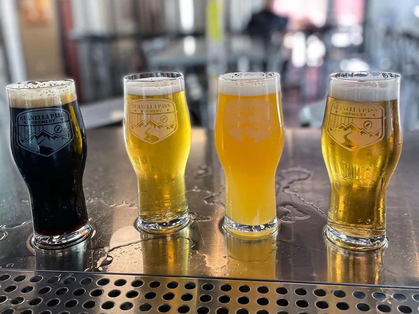 four beers in glasses