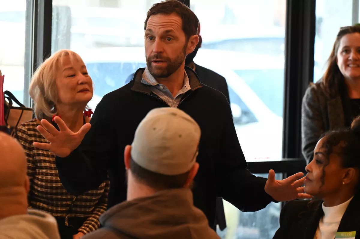 Congressman Jason Crow speaks to business owners.