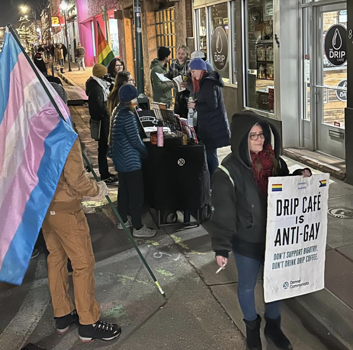 Protesters with Denver Communists and within the LGBTQ+ community hold a demonstration at the Drip Cafe in Denver, Colorado.