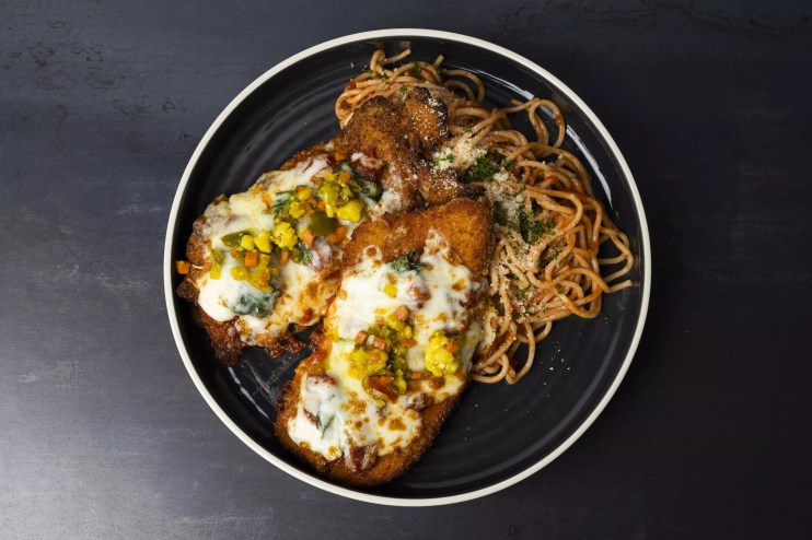 chicken parm with pasta on a plate