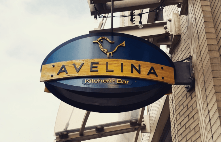 a blue sign that says "avelina"