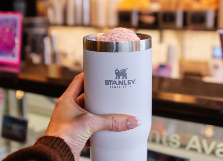 hand holding a stanley cup filled with ice cream
