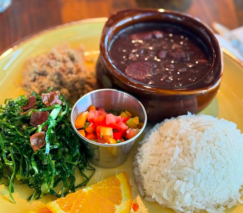 beans and rice on a plate with greens