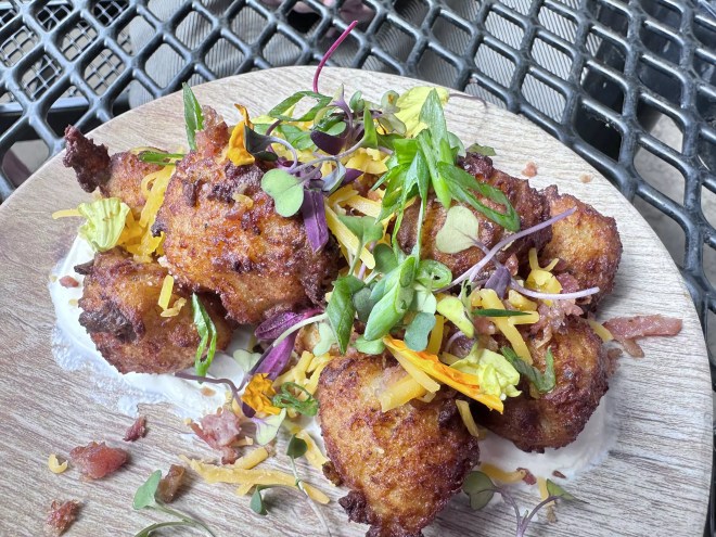 tater tots garnished with greens