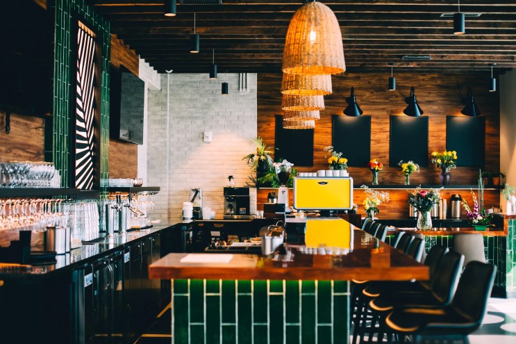 a bar with green tile