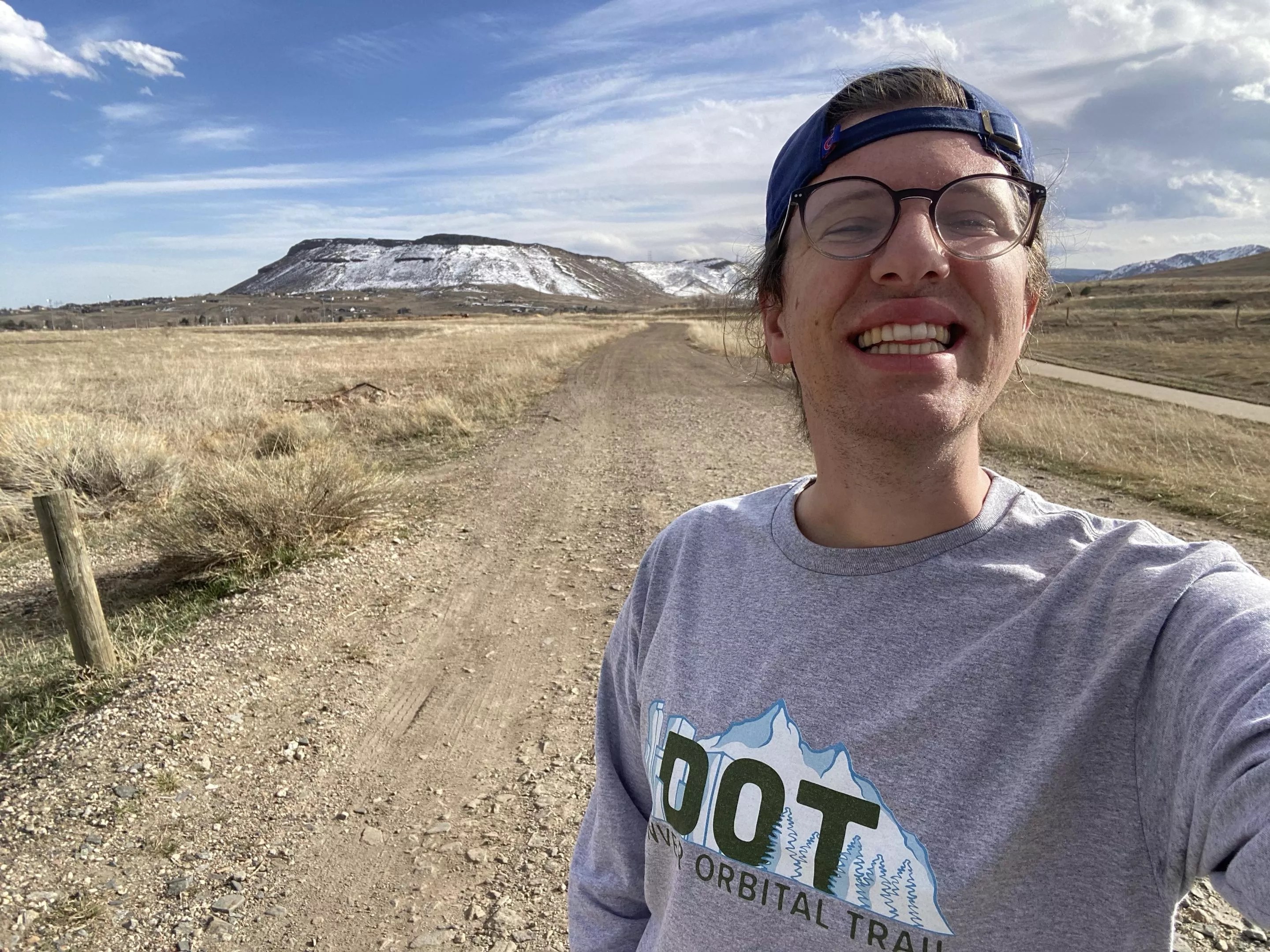 Michael Tormey smiling to camera while on the Denver Orbital Trail